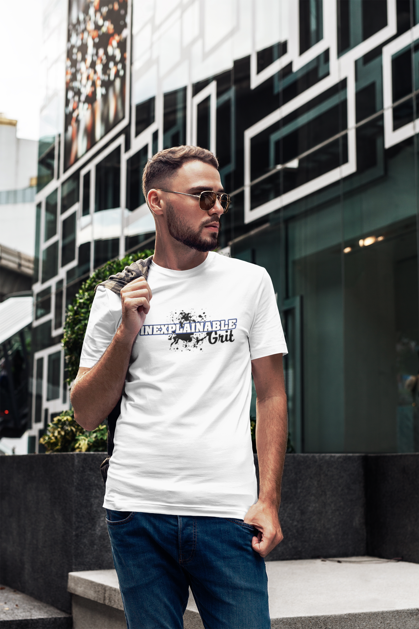 Male model, white Inexplainable Grit T-shirt, sunglasses, outdoors